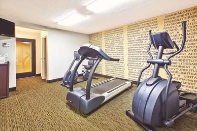 a gym with two exercise bikes in a room at La Quinta Inn by Wyndham Toledo Perrysburg in Perrysburg