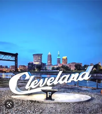 a sign that says leeland with a city in the background at Short Term Rentals Little Italy Cleveland in Cleveland
