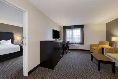 a hotel room with a bed and a television at La Quinta by Wyndham Cleveland Macedonia in Macedonia