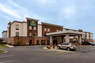 a car parked in a parking lot in front of a hotel at La Quinta by Wyndham Columbus - Grove City in Grove City