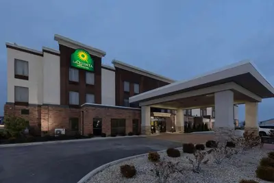 a hotel with a sign on the front of it at La Quinta by Wyndham Columbus - Grove City in Grove City