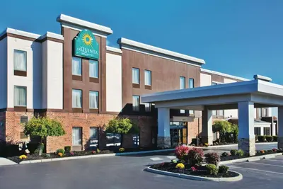 a rendering of a hotel with a parking lot at La Quinta by Wyndham Columbus - Grove City in Grove City