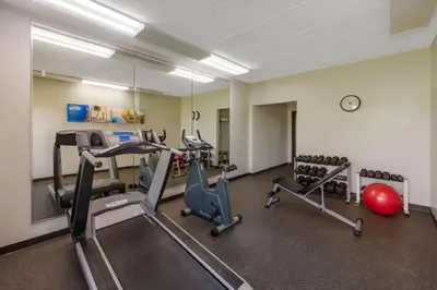 a gym with treadmills and exercise bikes in a room at Comfort Inn & Suites Tipp City Dayton North I-75 in Tipp City