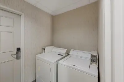 a laundry room with a washer and dryer at Comfort Inn & Suites Tipp City Dayton North I-75 in Tipp City