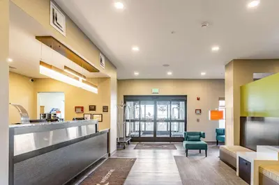 a lobby of a hospital with a waiting room at Sleep Inn & Suites Mt Hope near Auction & Event Center in Millersburg