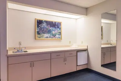 a bathroom with a sink and a mirror at Quality Express Inn & Suites in Mineralwells