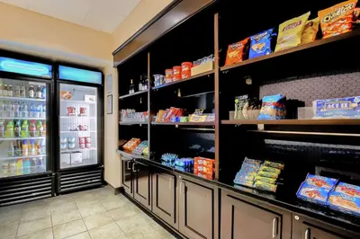 a grocery store aisle with an open refrigerator at Hampton Inn & Suites Wheeling - The Highlands in Triadelphia
