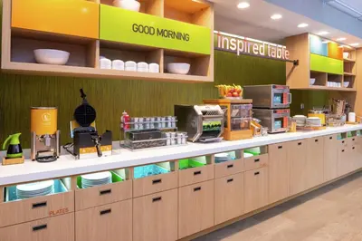 a store with a counter with food items on it at Home2 Suites By Hilton New Albany Columbus in New Albany