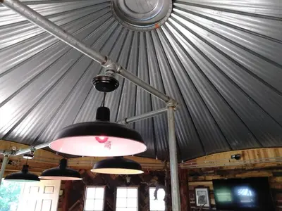 aendant light hanging from a ceiling in a tent at The Highlander - Rustic Mountain Yurt in Genoa