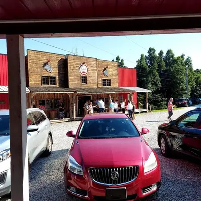 a red car parked in front of a building at The Sandstone - A 3BR, 2BA Deluxe Log Cabin in Genoa