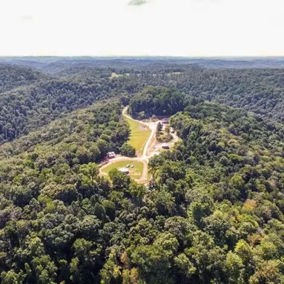 an aerial view of a park in the middle of a forest at The Sandstone - A 3BR, 2BA Deluxe Log Cabin in Genoa