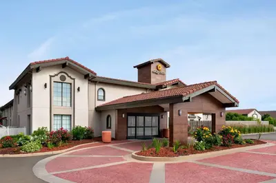 a building with a clock tower on top of it at La Quinta Inn by Wyndham Columbus Airport Area in Columbus