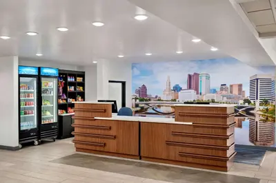 a kitchen with a city skyline mural on the wall at La Quinta Inn by Wyndham Columbus Airport Area in Columbus