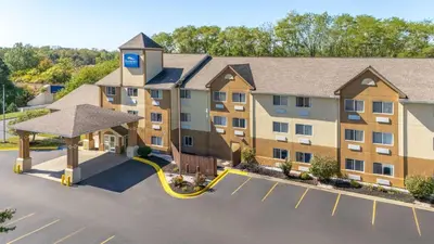 an overhead view of a hotel with a parking lot at Baymont by Wyndham Piqua in Piqua