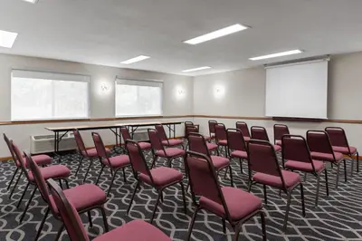 a conference room with a bunch of chairs in it at Baymont by Wyndham Piqua in Piqua