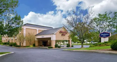 a building with a sign in front of it at Hampton Inn Wooster in Wooster