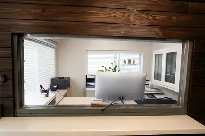 a window in a room with a computer on a desk at Paragon Inn Hillsboro in Hillsboro