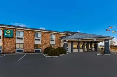 an image of a hotel with a parking lot at Quality Inn Marysville in Marysville