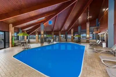 a large pool with blue water in a hotel lobby at Quality Inn Marysville in Marysville