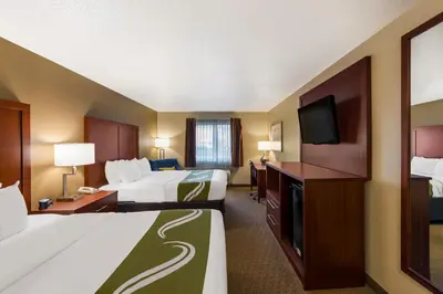 a hotel room with two beds and a flat screen tv at Quality Inn Marysville in Marysville