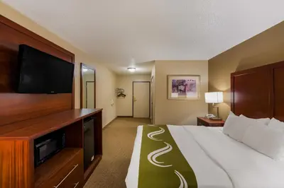 a hotel room with a bed and a flat screen tv at Quality Inn Marysville in Marysville