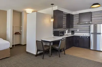 a kitchen with a table and chairs in a room at Residence Inn by Marriott Cleveland University Circle/Medical Center in Cleveland