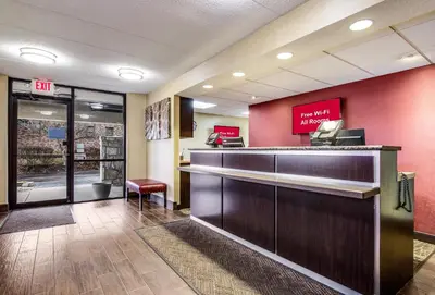 a hotel lobby with a cash register and a waiting room at Red Roof Inn Lexington in Lexington