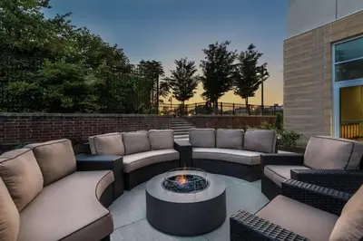 a patio with couches and a fire pit at Hampton Inn & Suites Fort Wayne Downtown in Fort Wayne