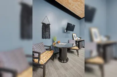 two pictures of a room with a table and chairs at Indigo Pass Boutique Hotel in Middletown