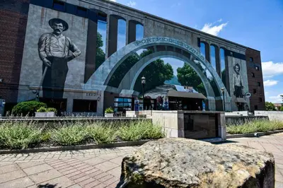 a statue of a man in front of a building at Indigo Pass Boutique Hotel in Middletown