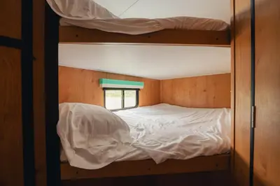 a couple of bunk beds in a room at Pine Creek Cabins & Camping Resort in South Bloomingville