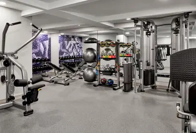 a fitness room with a gym with tread machines at Delta Hotels by Marriott Toledo in Toledo