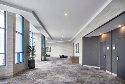an office lobby with a hallway with a potted plant at Delta Hotels by Marriott Toledo in Toledo