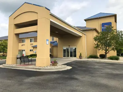 a parking lot in front of a building at Baymont by Wyndham Fort Wayne in Fort Wayne
