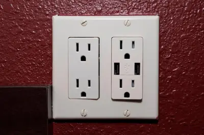 a white light switch on a red wall at Red Roof Inn Dayton - Fairborn/Nutter Center in Fairborn