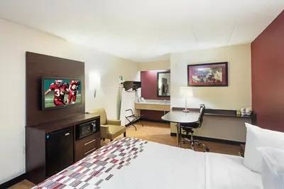 a hotel room with a bed and a desk at Red Roof Inn Dayton - Fairborn/Nutter Center in Fairborn