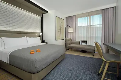 a hotel room with a bed and a desk at Canopy By Hilton Columbus Downtown Short North in Columbus