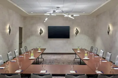 a conference room with a large table and chairs at Delta Hotels by Marriott Ashland Downtown in Ashland