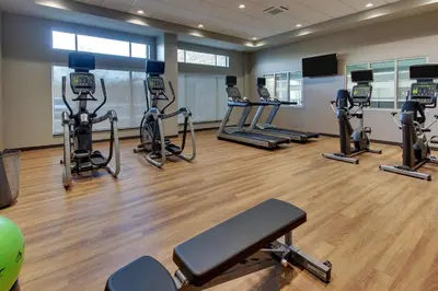 a gym with several treadmills and elliptical machines at Drury Inn & Suites Cleveland Beachwood in Beachwood