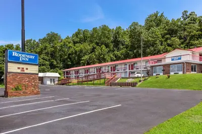 a parking lot in front of a building at Rodeway Inn South Point in South Point