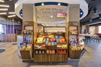 a grocery store with a display of food at Tru By Hilton Beavercreek Dayton in Fairborn