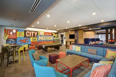 a lobby with couches and a ping pong table at Tru By Hilton Beavercreek Dayton in Fairborn