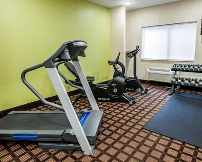 a gym with two exercise bikes in a room at Baymont by Wyndham Richmond I-70 in Richmond