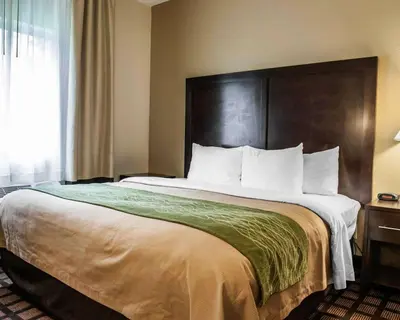 a large bed in a hotel room at Baymont by Wyndham Richmond I-70 in Richmond