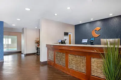 an office lobby with a reception desk with a crescent moon on the wall at Comfort Inn & Suites North Greenfield in Greenfield