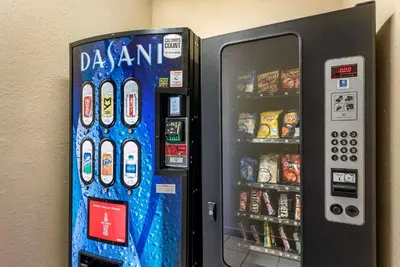a vending machine is next to a wall with snacks at Comfort Inn & Suites Muncie Near University in Muncie