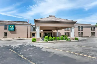 a building with a parking lot in front of it at Quality Inn & Suites Near Amish Country in Rushville