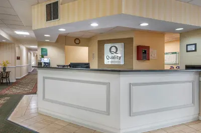 a lobby with a counter in a waiting room at Quality Inn & Suites Near Amish Country in Rushville