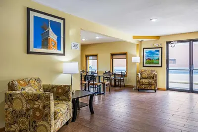 a living room with a couch and chairs and a table at Quality Inn & Suites Greensburg I-74 in Greensburg