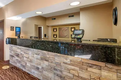 a hotel lobby with a reception counter with a pay phone at Comfort Inn Shelbyville North in Shelbyville